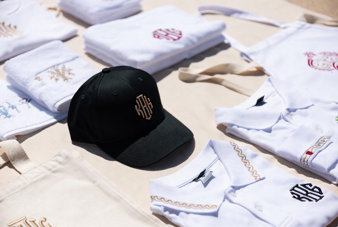 Custom monogram embroidery on caps, polos, towels and tote bags by Aventura Tailors
